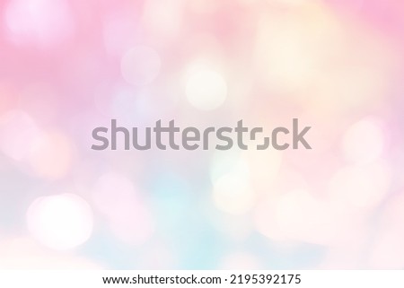 Blurred bokeh background for Christmas and New Year holiday. Abstract pastel pink gradient color wallpaper with defocused lights. Copy space. Banner