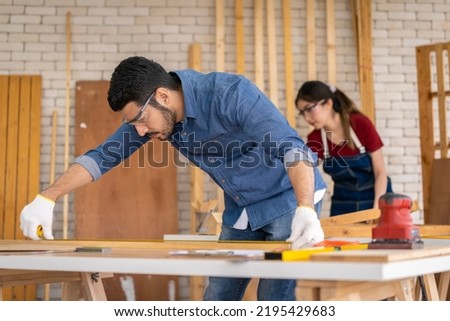 Smart and good looking Asian male carpenter. I am designing furniture to decorate my house. professionally