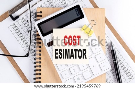 COST ESTIMATOR word on a sticky with clipboard and notebook, business concept