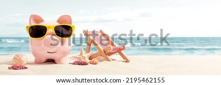Piggy bank resting on vacation. Saving money, travel concept Royalty-Free Stock Photo #2195462155