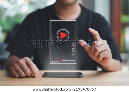 Man touch press button virtual short video online watch media screen with smart phone Using the Internet to connect to media, video, chat, doing business.