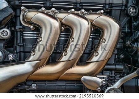 detail of triple engine heavy roadster motorcycle Royalty-Free Stock Photo #2195510569