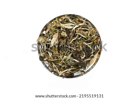Bai Mu Dan White Tea. Dried Tea Leaves on white background. Baimudan Tea. Chinese Tea.Top view. Close up. High resolution stock photos. 