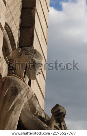 This is an image of a female statue taken in London on a hot summers day.