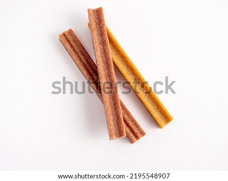 Close up dog tooth stick to reduce tartar buildup isolated on white. Canine dental sticks. Royalty-Free Stock Photo #2195548907