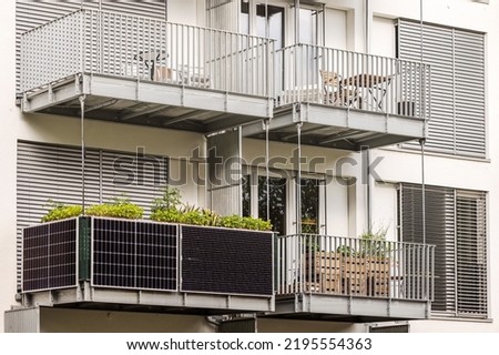 Solar panels on Balcony of  Apartment Building in City. Modern Balcony with Solar Panel. Royalty-Free Stock Photo #2195554363