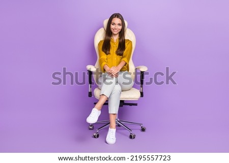 Full length photo of cute lady sit wear blouse trousers shoes isolated on violet color background