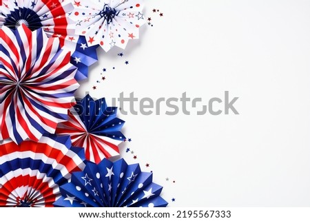 4th of July American Independence Day, Columbus Day, Labor day holiday composition. Red white and blue paper fans and confetti isolated on white background