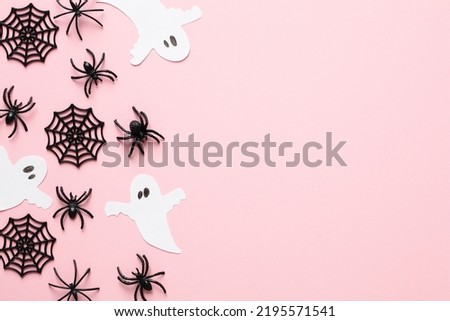 Halloween decorations on pastel pink background. Happy Halloween holiday concept. Flat lay, top view, copy space