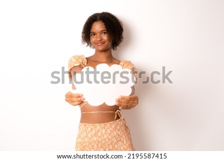 Close up photo of funny pretty dark skin lady holding paper cloud mind thinking over creative dialogue answer doubtful in casual clothing isolated white background.