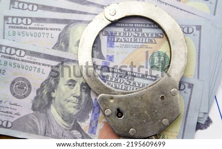 Fraud concept.police handcuff on banknotes.