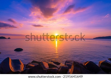 Landscape Long exposure of majestic clouds in the sky sunset or sunrise over sea with reflection in the tropical sea Beautiful seascape scenery Amazing light of nature sunset Royalty-Free Stock Photo #2195641649