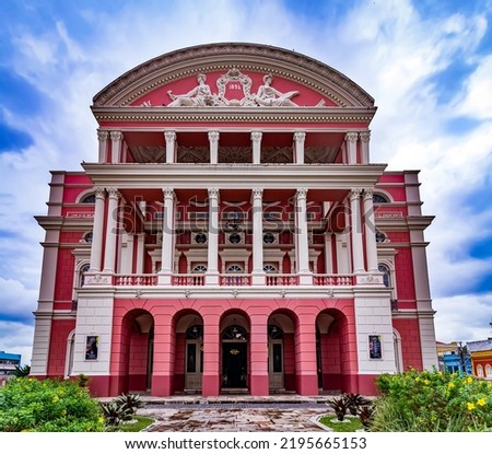 The unique richness of the details of the renaissance facade of the Amazonas theater in the city of Manaus with the partly cloudy sky above. Royalty-Free Stock Photo #2195665153