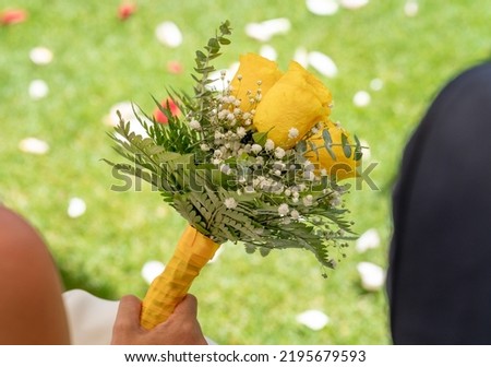 Close-up with beautiful bouquet of yellow flowers for wedding celebration.