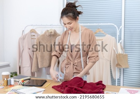 Professional designers are cutting fashionable clothes in the design studio, Fashion designer, Creativity and ideas, Mannequin, Shirt sketch, Color scheme, Garment accessories ,work independently.