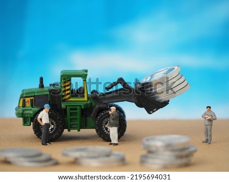 Finance, economy, coin, crypto mining, blockchain and saving money concept design. Toy and diecast photography concept. Unfocus and blurred view at land. Background is blurred and bokeh.