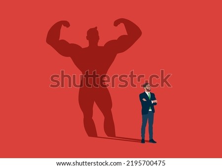 Businessman dreams of becoming a bodybuilding. Confident handsome young man standing bodybuilding shadow concept illustration. Royalty-Free Stock Photo #2195700475