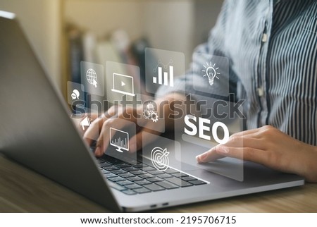 SEO Concept.Women using a computer with SEO icon for analysis SEO Search Engine optimizing your website to rank in search engines or SEO. best promoting ranking traffic on your website. Royalty-Free Stock Photo #2195706715