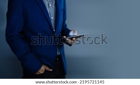 Close-up view of a businessman using a phone, empty space on the right.