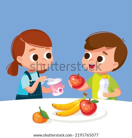 A boy and a girl eating healthy eco food. Kids have fruits and milk, dairy products for breakfast. Girl consumes yogurt. The boy eats apple for breakfast, lunch or snack. Summer family meal. Royalty-Free Stock Photo #2195765077