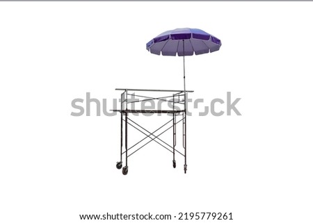 Isolated photo of outdoor scaffolding with purple sun umbrellas.