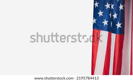 The American flag is on a white background. Space for text. Close-up photo