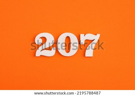 Number 207 - On orange foam rubber background