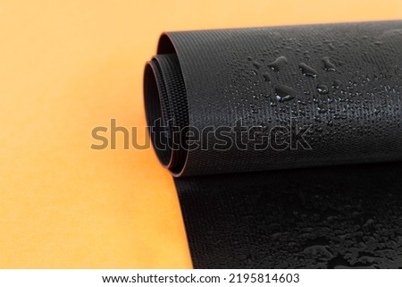 
Water droplets on the rubber membrane. Waterproofing...  Close-up selective focus area. Royalty-Free Stock Photo #2195814603