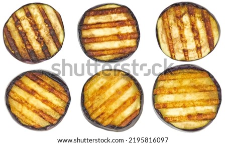 grilled eggplants isolated on white background. Grilled or fire roasted aubergine isolated on white background.Slice of eggplant roasted on a grill with stripes from a grill on a white background. Royalty-Free Stock Photo #2195816097