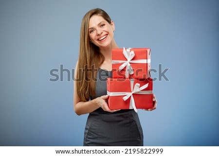 Business woman holding paper gift boxes.