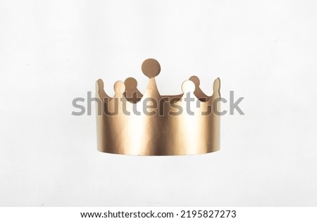 paper gold crown isolated on white background Royalty-Free Stock Photo #2195827273