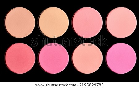 Powder makeup on black background. Makeup colour palette in circular shapes. 