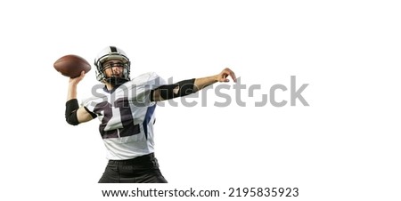 Portrait of young man, professional american football player training, throwing ball isolated over white background. Concept of active life, team game, energy, sport, competition. Copy space for ad
