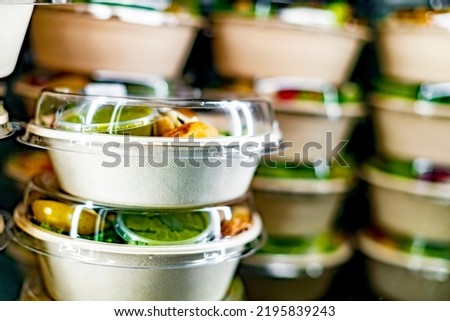 Pre-packaged ready to eat meals displayed in a commercial refrigerator Royalty-Free Stock Photo #2195839243