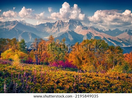 Beautiful autumn scenery. Breathtaking morning scene of Upper Svaneti, Georgia, Europe. Fantastic autumn view of Caucasus mountains. Traveling concept background.
