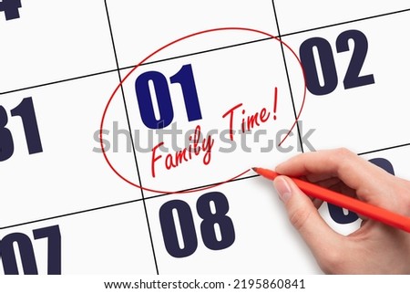 1st day of the month. Hand writing text FAMILY TIME and circling the calendar date. More Family Time. Calendar page with a reminder of the family date. Day of the year concept.