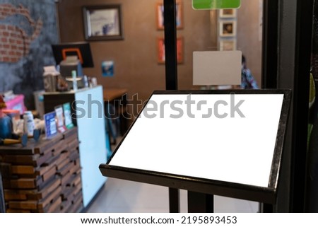 Mock up perspective blank signboard with clipping path, on panel of restaurant, empty space for insert advertising or announcement information promotion