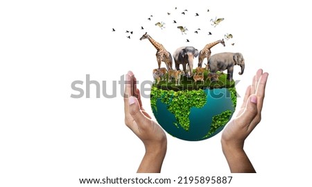 World Animal Day World Wildlife Day  Groups of wild beasts were gathered in the hands of people Royalty-Free Stock Photo #2195895887