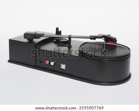 Mini usb turntable on a white background. Mini stereo vinyl recorder player. Turntable what supports converting your vinyl into MP3 or WAV files