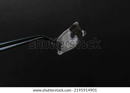 closeup photo of the implantable collamer lens ICL for treating  Royalty-Free Stock Photo #2195914901