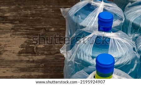 A bottle with a clean liquid closed with a lid. Space for printing text. Background picture.