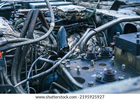 The engine and equipment of a military vehicle. Tubes, tanks and mechanisms of the propulsion system Royalty-Free Stock Photo #2195925927