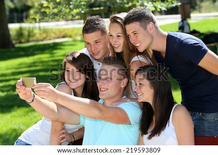 Group of teen taking pictures