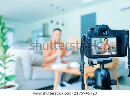 Cheerful Asian man checking and packing parcel at home, Asian man with parcel ,online seller concept.