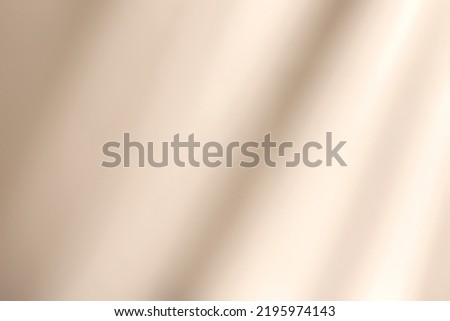 Abstract diagonal window shadows and light on solid beige wall texture. Abstract trendy colored natural light concept background. Copy space for text overlay, poster mockup, flat lay, top view Royalty-Free Stock Photo #2195974143
