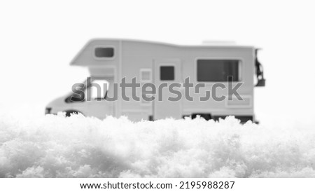 Winter camping. Motorhome in nature, nomadic life for travelers on winter vacation.