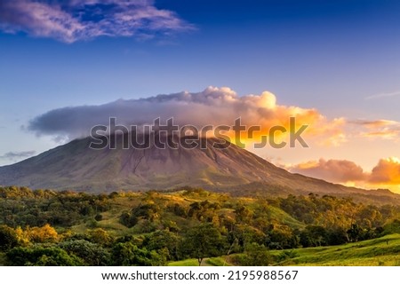 Arenal volcano under the clouds, Costa Rica. Royalty-Free Stock Photo #2195988567