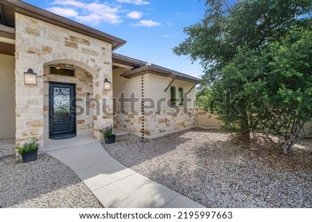 a beautiful home entrance with stone accents