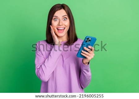 Photo of surprised lady positive read gadget media news about giveaway web discounts isolated on green color background