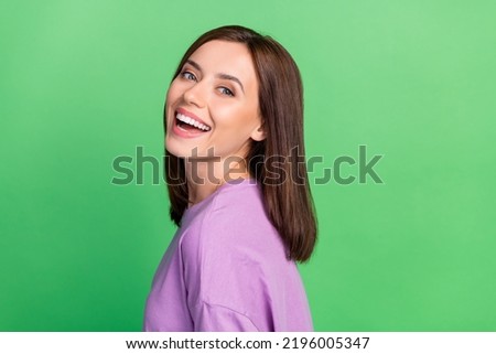 Photo of pretty cute lady beaming smiling enjoy bright shine veneers isolated on green color background Royalty-Free Stock Photo #2196005347
